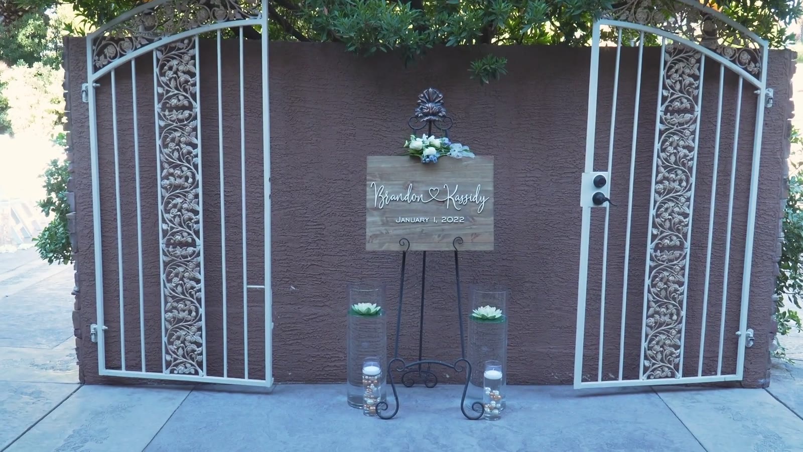 The gated entrance with the welcome sign